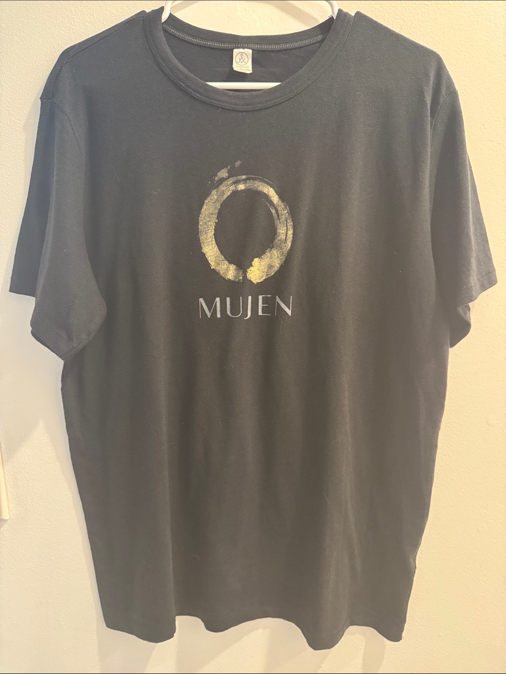 Alternative Black Short Sleeve Tee with Gold Circular Logo